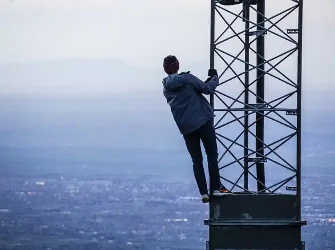 man on top of a tower
