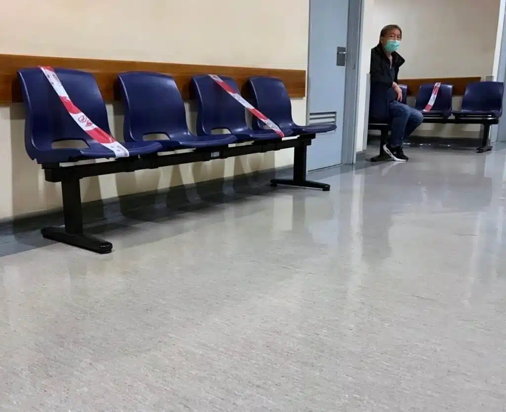 Man in Waiting Room with closed seats